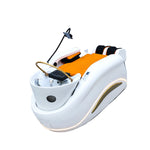 Load image into Gallery viewer, Modern pedicure chair with orange seat in a white room, featuring the Shunlong logo.