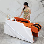 Load image into Gallery viewer, Woman standing next to a modern orange and white bathtub.
