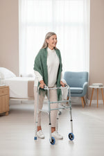 Load image into Gallery viewer, Woman using a walker in a home setting
